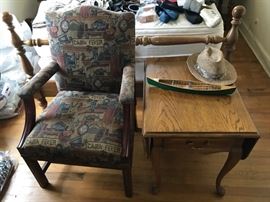 Cabin theme upholstered chair beside lamp table