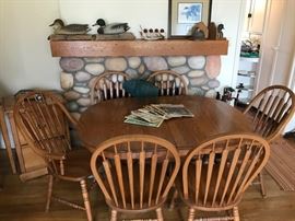 Oak table & Chair set.  Table has two self-storing leaves.  
