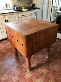 Exceptional butcher block used as an island.  Bring muscle!
