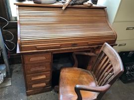 The roll top desk closed.  The roll works nicely