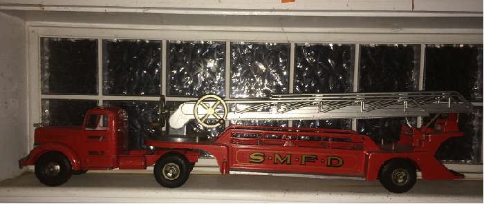 SmithMiller ladder truck, some playware and priced to move at $175, a fraction of current auction value