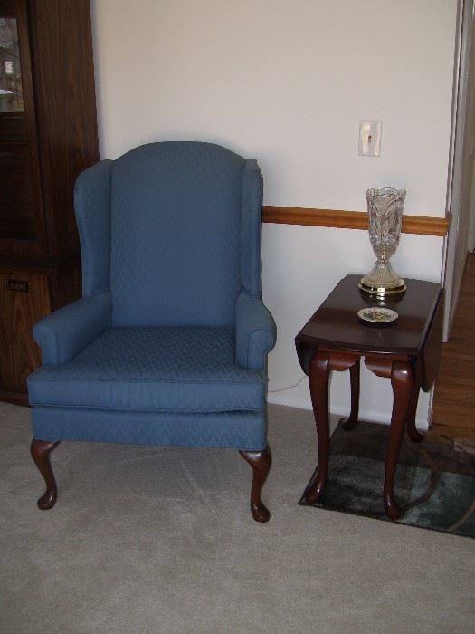 One of 2 wing back chairs with drop leaf end table.