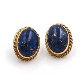 14K Yellow Gold Lapis Lazuli Stud Earrings: A pair of 14K yellow gold lapis lazuli earrings. Each earring features a central bezel set lapis lazuli stone in a braided frame.