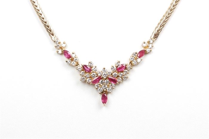 14K Yellow Gold 1.70 CTW Diamond and Ruby Necklace: A yellow gold foxtail chain is enhanced by round cut shared prong diamonds that surround faceted marquise cut rubies.