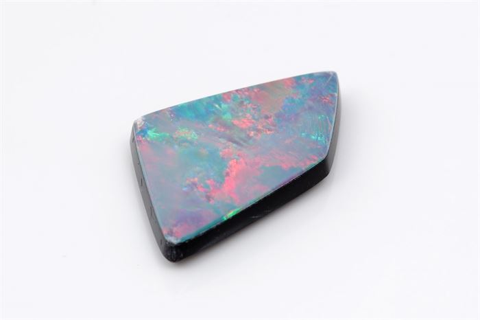 6.00 CT Opal Doublet: A loose iridescent opal doublet.