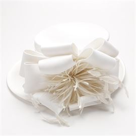 Whittall & Shon White Derby Hat: A Whittal & Shon white Derby hat. This women’s white hat displays a large white bow with a central feathered applique.