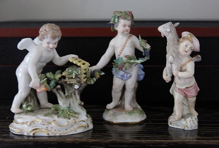 trio of antique cherub figurines (two Meissen, one KPM).  Small chips, bumps and knocks.