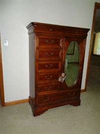 Armoire in very nice king bedroom suite. Hardwood w/cherry finish. Henry Link