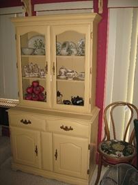 Painted cabinet with glass doors.