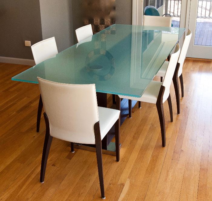Glass top dining table, with wood and metal base. Table measures 94.5" long, 39.5" wide. Six Cattelan Italia leather Arcadia chairs. 