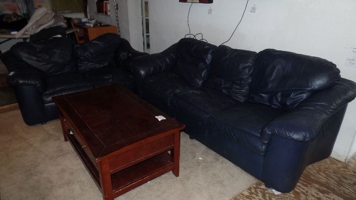Blue black leather couch and love seat