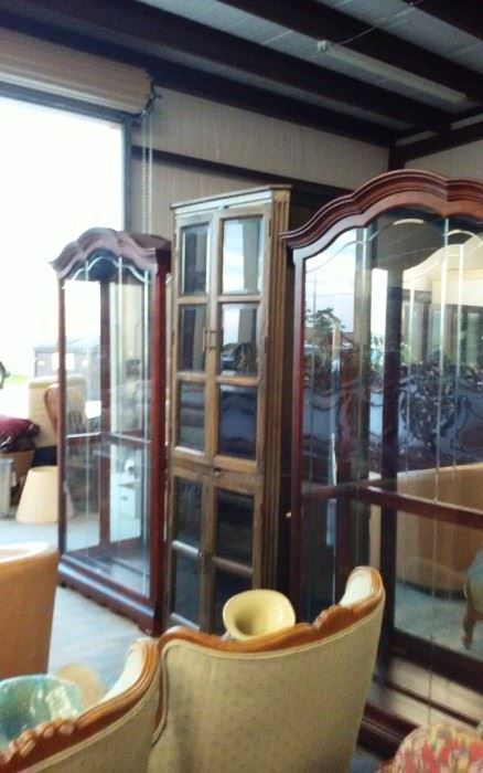 Many curio cabinets and glass shelves.   Side entry cabinets and in great shape
