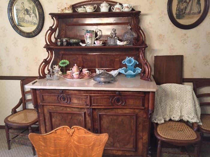 Victorian marble top buffett, cane bottom chairs, prints, glassware