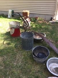 old plow, old buckets and tins