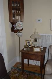 Lots of Collectibles in Corner Cabinet Floor Lamp is going with the family