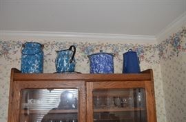 Antique Blue Spongeware Cream Pail, Pitcher, Lidded Pail, & Graniteware Coffee Pot all displayed on Antique American Oak Kitchen Cabainet with pull down bin and double door glass display