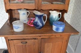 Salt Glaze Pitchers, Lidded Butter and Salt all displayed on Antique American Oak Kitchen Cabainet with pull down bin and double door glass display