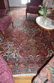 Another Gorgeous Antique Rug in the Historic Home. There are 3 9' x 12' Bakhtiari Rugs all with cloth tags made in Iran and one smaller Bakhtiari approx. 3' x 9'.