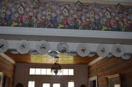 Lots of Collectible Plates on both sides of the Ceiling Beam