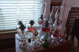 A number of Antique Oil Lamps many with rare base designs 