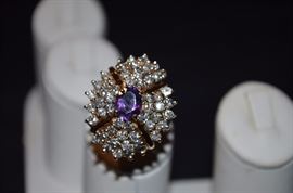 #3. Beautiful Amethyst & Diamond Ring Ladies 14k yellow gold Cluster Style Ring mounting weighting approx. 9.21dwt and is set in center with one Oval Cut Amethyst measuring approx. 8.8mm in length by approx 4.8mm in depth and weighs approx. 1.60ct. Set around center are 52 Round Brilliant Cut Diamonds totaling approx. 3.12ct. The Color is F-G and Clarity is I(1), -I(2)