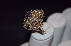 #3. Beautiful Amethyst & Diamond Ring Ladies 14k yellow gold Cluster Style Ring mounting weighting approx. 9.21dwt and is set in center with one Oval Cut Amethyst measuring approx. 8.8mm in length by approx 4.8mm in depth and weighs approx. 1.60ct. Set around center are 52 Round Brilliant Cut Diamonds totaling approx. 3.12ct. The Color is F-G and Clarity is I(1), -I(2)