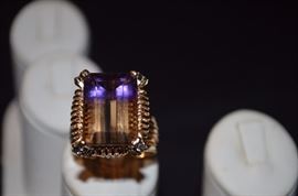 #4. Brilliant Multi-Stone Ring Ladies 14k yellow gold Rectangle Shape Ring Mounting weighing approx. 9.97dwt and is set in center with one Emerald Cut Amatrine measuring approx. 18.25mm in length by approx. 13mm in width by approx. 9.7mm in depth and weighs approx. 15.30ct. The Gorgeous Ring is set with 4 Round Cut Blue Sapphires, 4 Round Cut Yellow Sapphires, and 4 Round Brilliant Cut Diamonds. The Diamonds measure approx.2.1mm in diameter and each weigh approx. 03/100ct. The color is SI(2) - I(1)