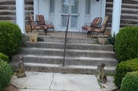 Antique Concrete Dogs also Patio Set in front of house