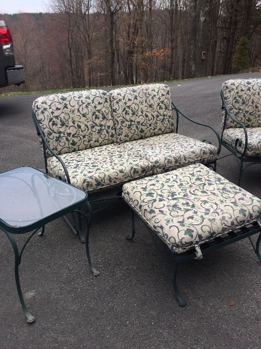 Very nice iron patio set. Includes loveseat, couch, foot stool, end table and coffee table