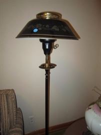One of a pair of tole standing lamps