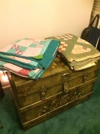 hand painted trunk & vintage quilts.