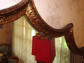 Vintage large (heavy) wall mirror, fan shaped, burnished gold frame.  63" wide at widest point, 30" at smallest point and 38-1/2" in height.