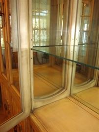 Two solid wood, china/curio cabinets, with a French Country feel.  Glass doors, sides and shelves, mirrored back, lighted, double door bottom storage area.  29-1/2" w, 15-1/2" d, 80" h.  Made in USA.