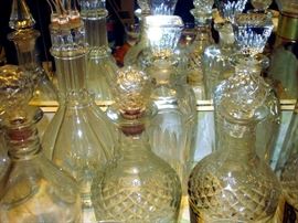 Assorted decanters, including four-section decanter with pourers.