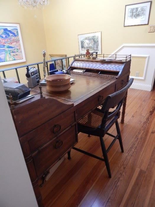 Nice home office desk and chair.The desk is very detailed with roll top sides and leather desk surface. The overall design shows a bamboo look.