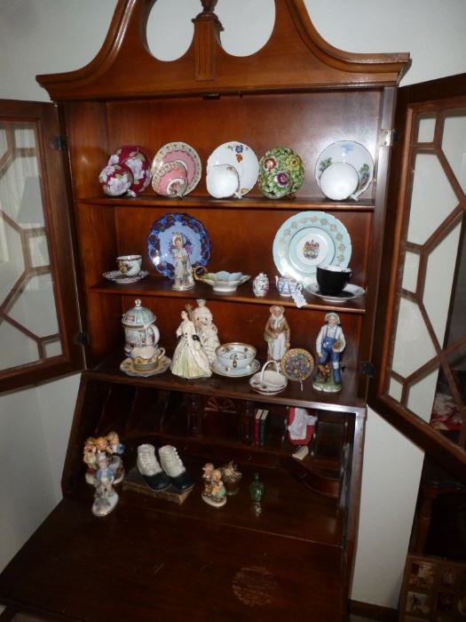 Antique display case, figurines, plates, and cups