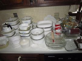The kitchen is full of Corning, cookware, bakeware, glassware...