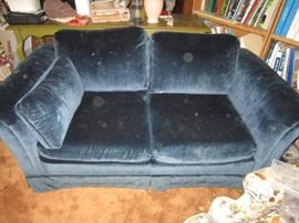 Blue velvet loveseat-looks better in person-spots are on camera