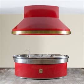 Impressive Custom-Made Molteni Stove, in Red Enamel: A quintessential and luxe modern oval-shaped Molteni custom-made “elliptical Podium” stove with hood. Touted as makers of opulent and professional kitchens, stove and ranges, the brand has been revered by master chefs since 1923. The bright red enamel, stainless steel stove features a very large preparation space with a sink with faucet at one end and well at the other which are on either side of a half-circle shaped steel French flat top, Schott Ceran ceramic-glass flat top burner and Schott Ceran ceramic-glass Wok burner and four storage drawers. The lighted hood features brass trim as well. Please visit the company website here for additional details.