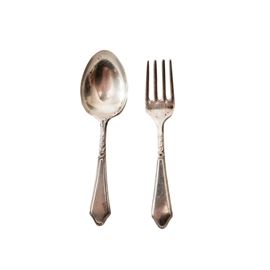Lunt "Chateau" Sterling Baby Set: A sterling baby set in the Chateau pattern by Lunt Silversmiths. This includes a baby spoon and fork with floral designs with paneled handles. The total approximate weight is 1.040 ozt.