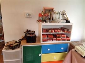 Pre-war lamp posts, tanks, stock car, gondola, Uto crossing, RR signals, transformers, throttle pack etc also child storage cabinet/chest of drawers
