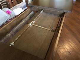 Belgian oak table stores leaves inside. Extends to 114 inches.