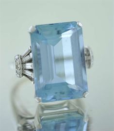 Lot 18: Aquamarine ring set in platinum w/approx. .23 ct aqua and accented by approx. .50 ct tw baguette and single cut rounds, size 8.25, 17.7 grams