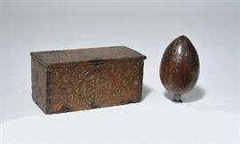 Lot 54: Well carved early lift top box-pinwheels Colonial man 8"L. with a carved coconut