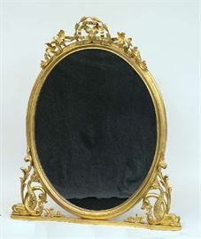 Lot 82: Good 19th C. Classical carved & gilt pier mirror with dolphin motifs, 62"H. x 54"W.