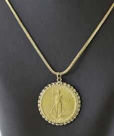 Lot 104: St. Gaudens $20 gold coin 1908 bezel set with an 18kt gold chain (16 grams, chain)