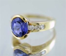 Lot 114: 14k gold tanzanite ring with diamonds