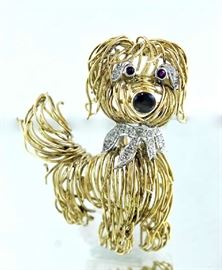 Lot 119: 14k yellow gold pin, set with diamonds and ruby eyes, 2.25"H., 20.5 grams