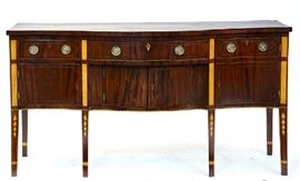 Lot 140: 19th C. mahogany swell front American sideboard with arrangement of drawers and doors with inlay and banded birdseye, 69.5"L. x 37"H. x 27"D. ca.1820