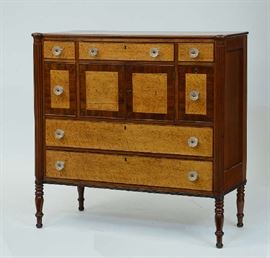 Lot 155: Federal 19th C. cherry and birdseye maple server with arrangement of seven drawers including bottle and two doors - cookie corner top - reeded columns ca.1820, 44.5"W. x 45"H. x 17.5"D.